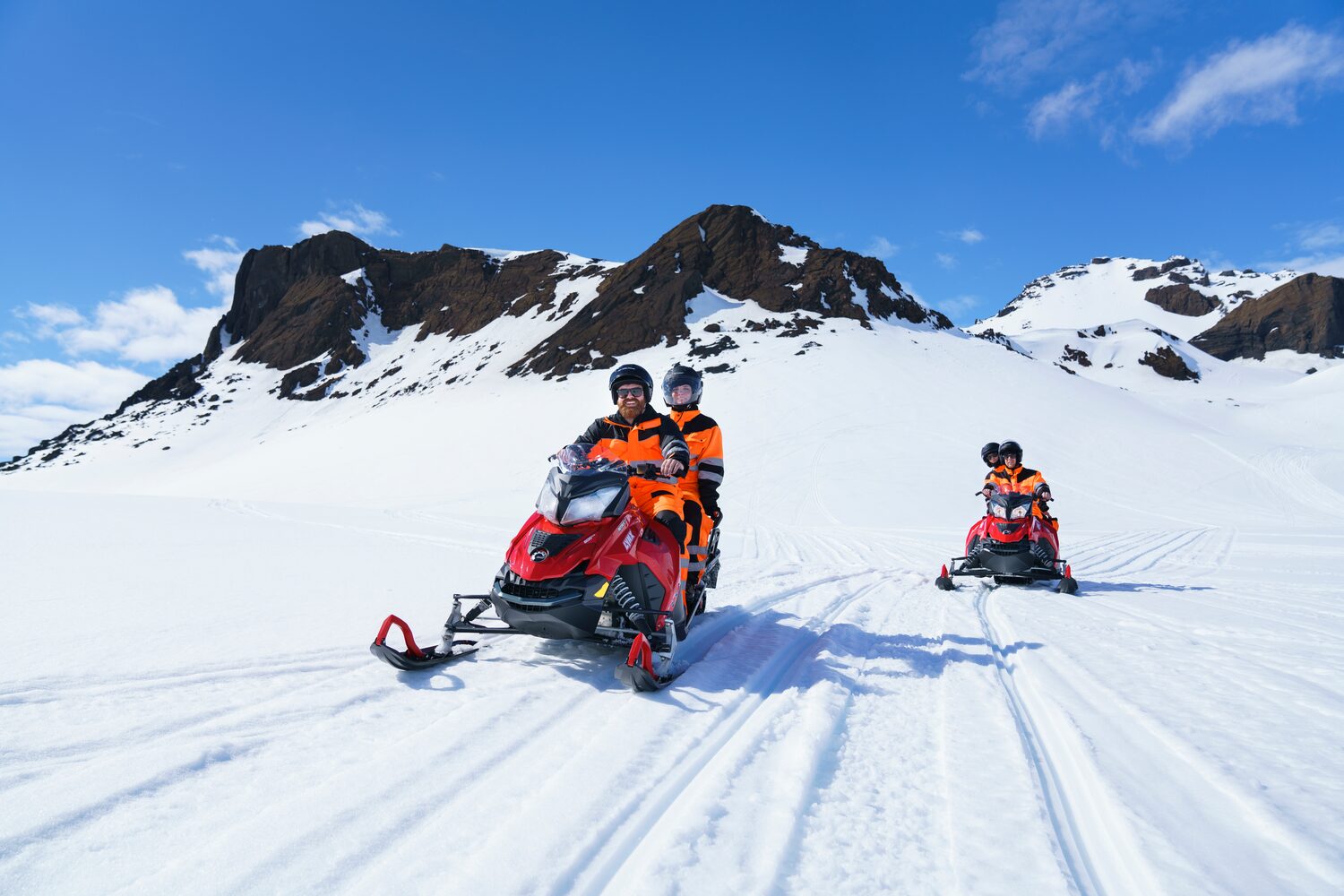 Three Tour Snowmobiles