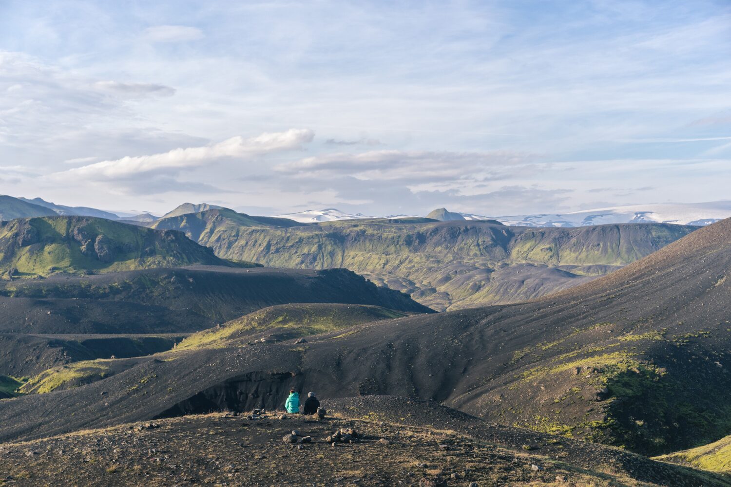 Two female hikers enjoying scenic view of Icelandic landscape. Þórsmörk National Park.