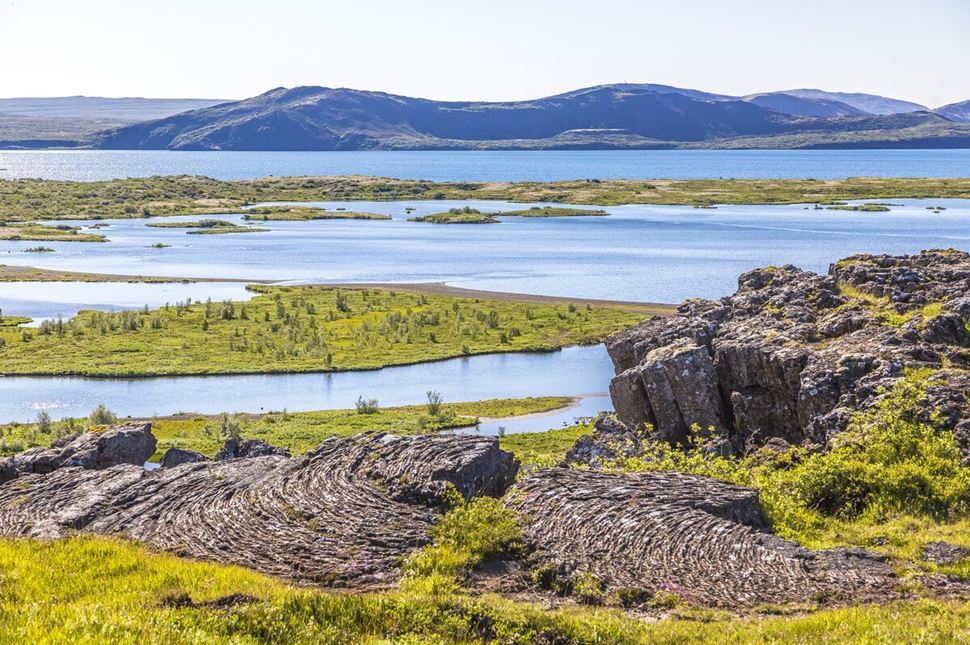 Natural Lake Thingvellir Natural lake in Thingvellir with islands of green grass and cliffs surrounding