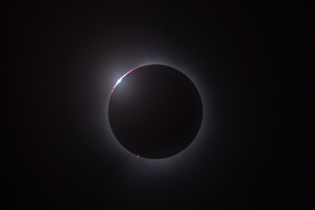 Almost full eclipse in dark night sky 