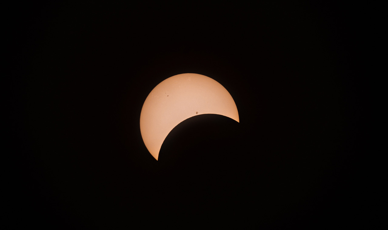 Black night sky with partial eclipse in view 