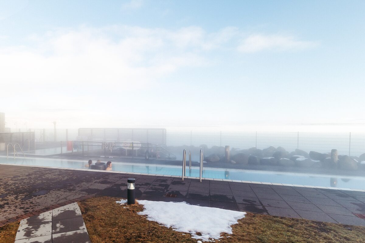 People bathe in hot pool