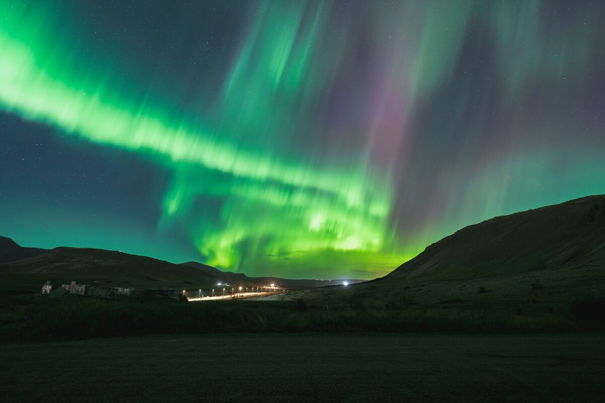 Northern light above mountains in Mosfellsdalur