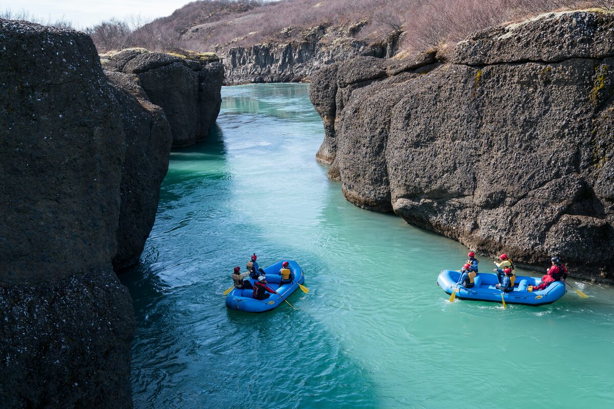 Rafters paddling through Brúarhlöð canyon on the Hvítá River in South Iceland. 