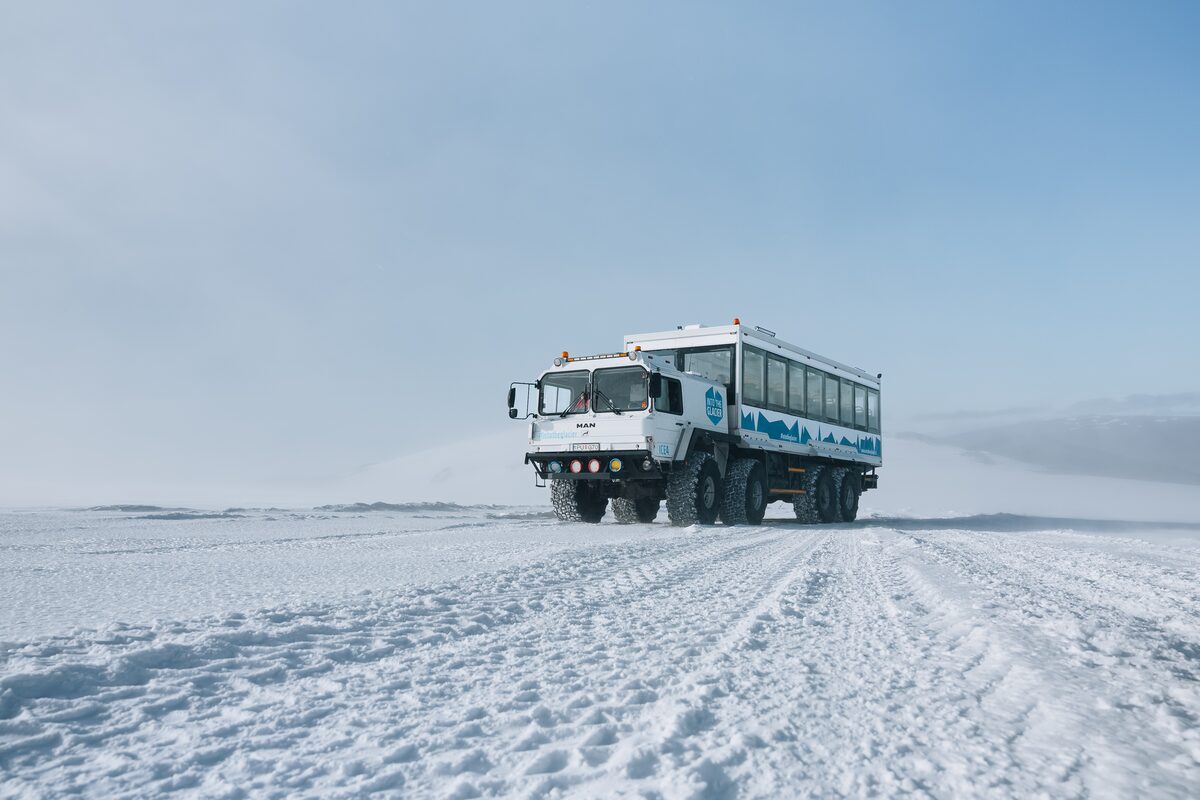 Monster truck driving up the glacier in Iceland