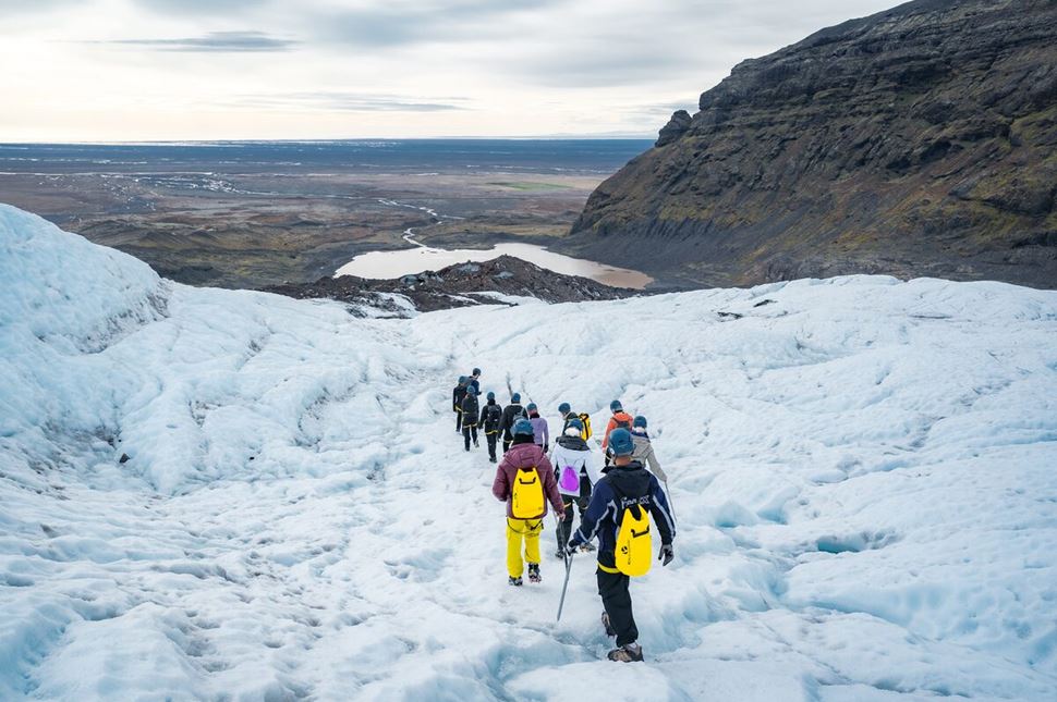 Tour Skafatafell Glacier  Small group of tourists on a Skaftafell glacier hike with view of surrounding glacier landscapes