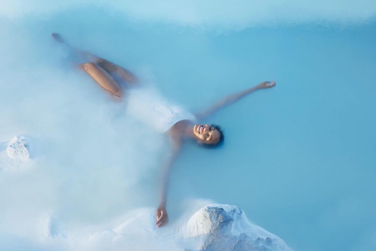 Woman relaxing in blue lagoon