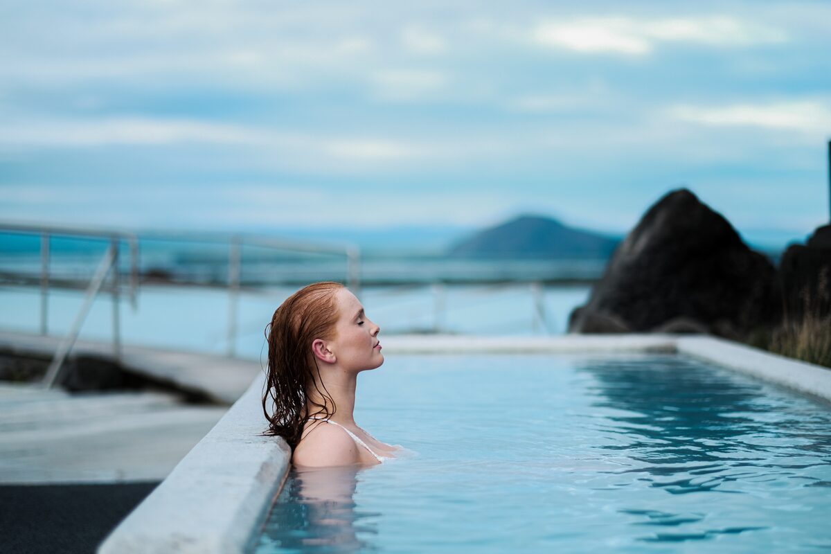 Woman soaking in Myvatn baths