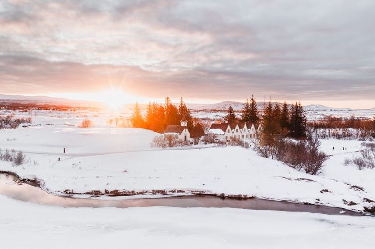 Thingvellir church and houses during winter at sunset