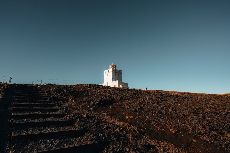 Steps To Lighthosue Autumn  Steps leading up to white lighthouse in the distance with autumnal landscape