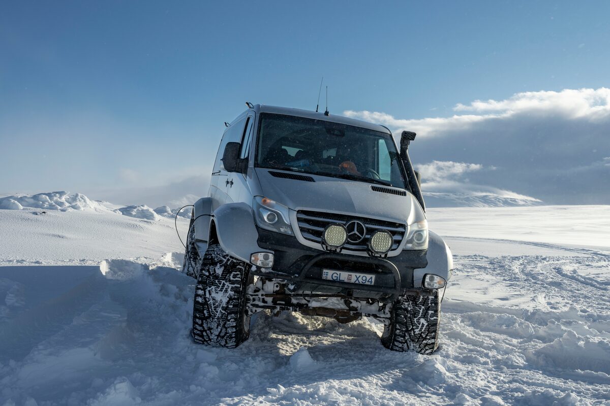 Giant super jeep driving in snow fields