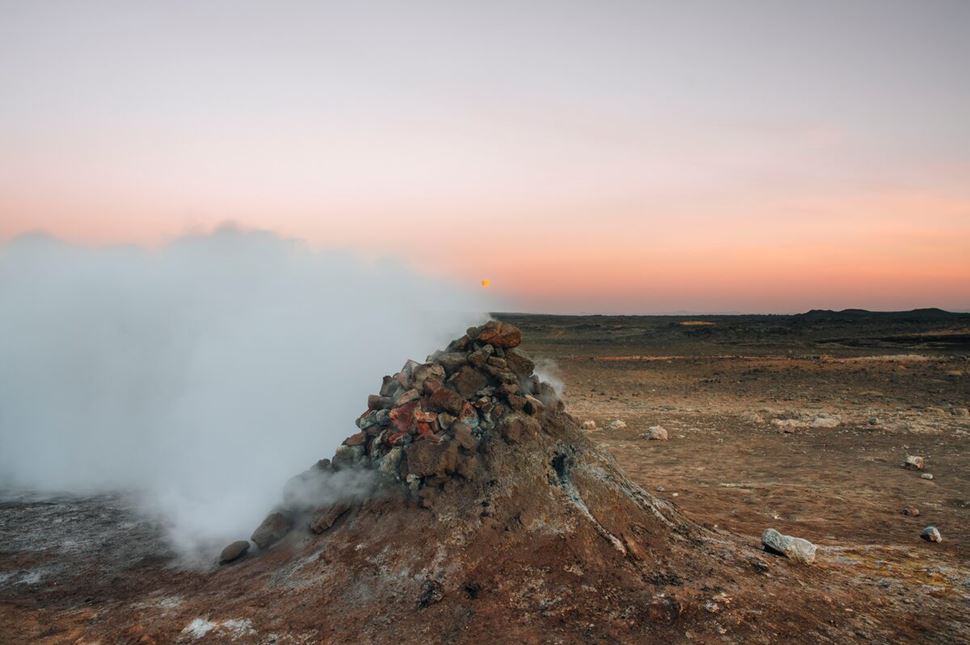 Active Myvatn Geothermal Area Sunset Active geothermal rock formation area smoking into pink sunset
