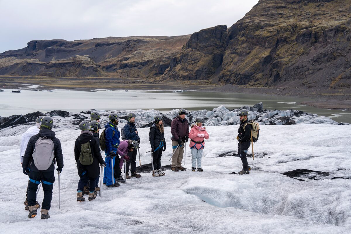 Guide with group on glacier in Iceland