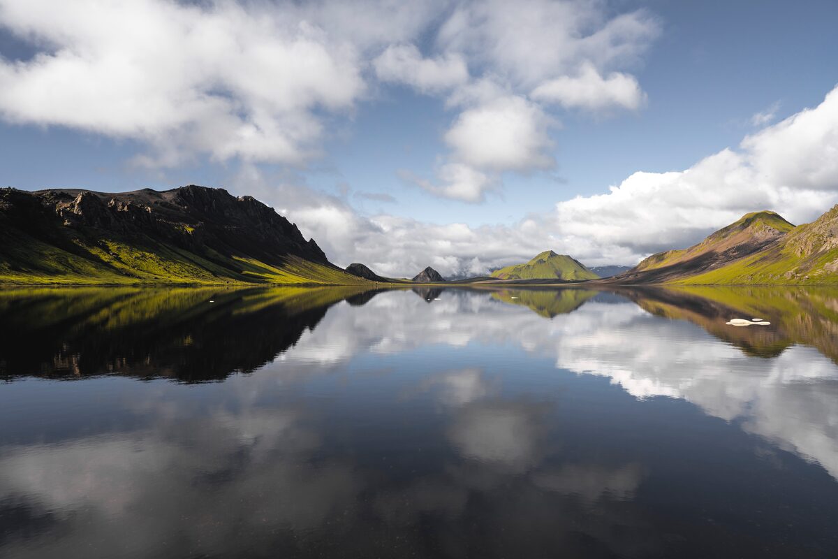 Reflections from sky reflecting into lake Alftavatn lake landscape shot