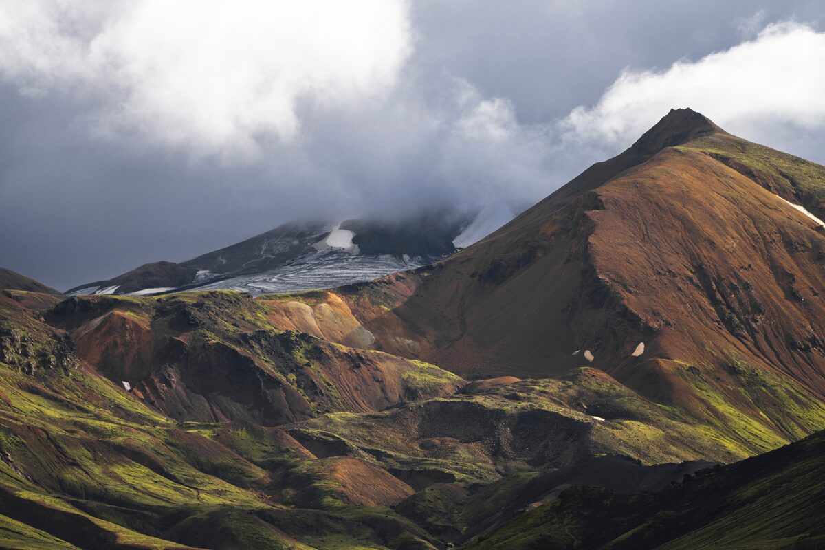 Beautiful scenic mountains in Jökultungur with cloudy grey skies over
