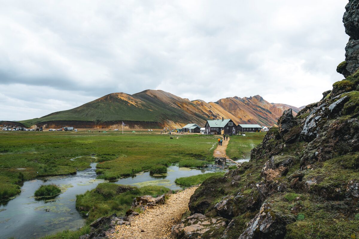 Natural hot springs and mossy rock, view of rhyolite mountains at camping site 
