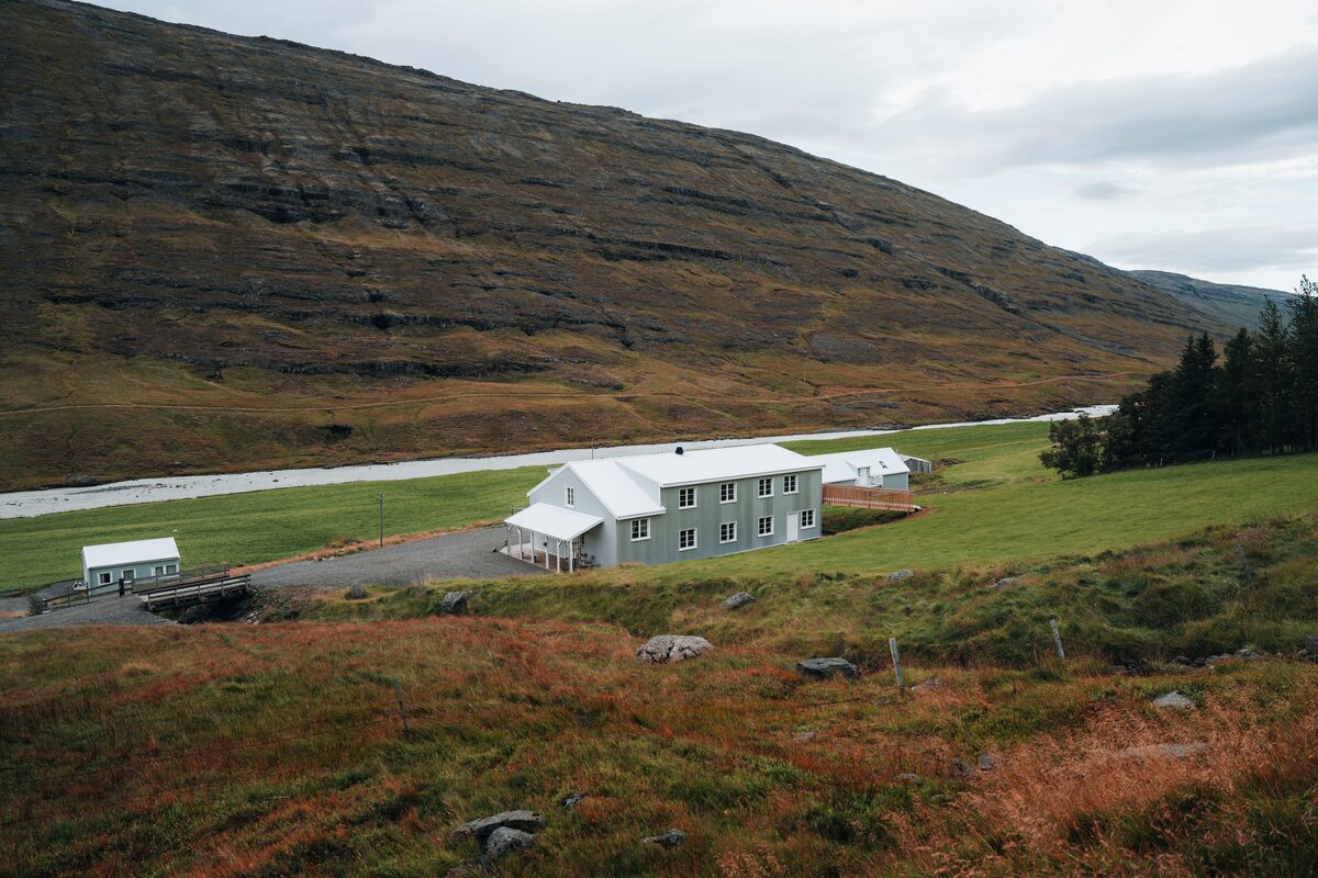 Wilderness center building on green field in East Iceland 