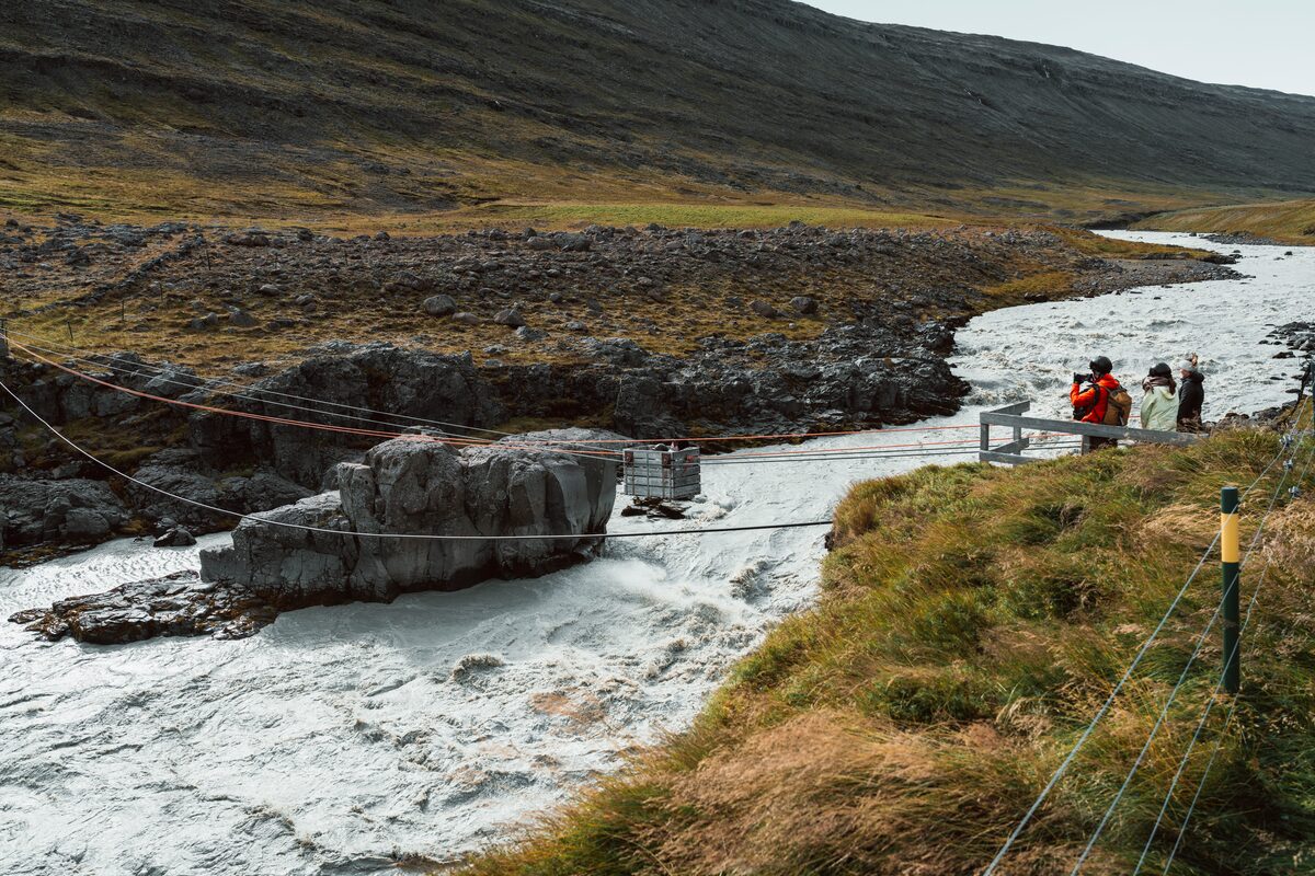 Wilderness center stream with rope wooden box crossing for tourists 