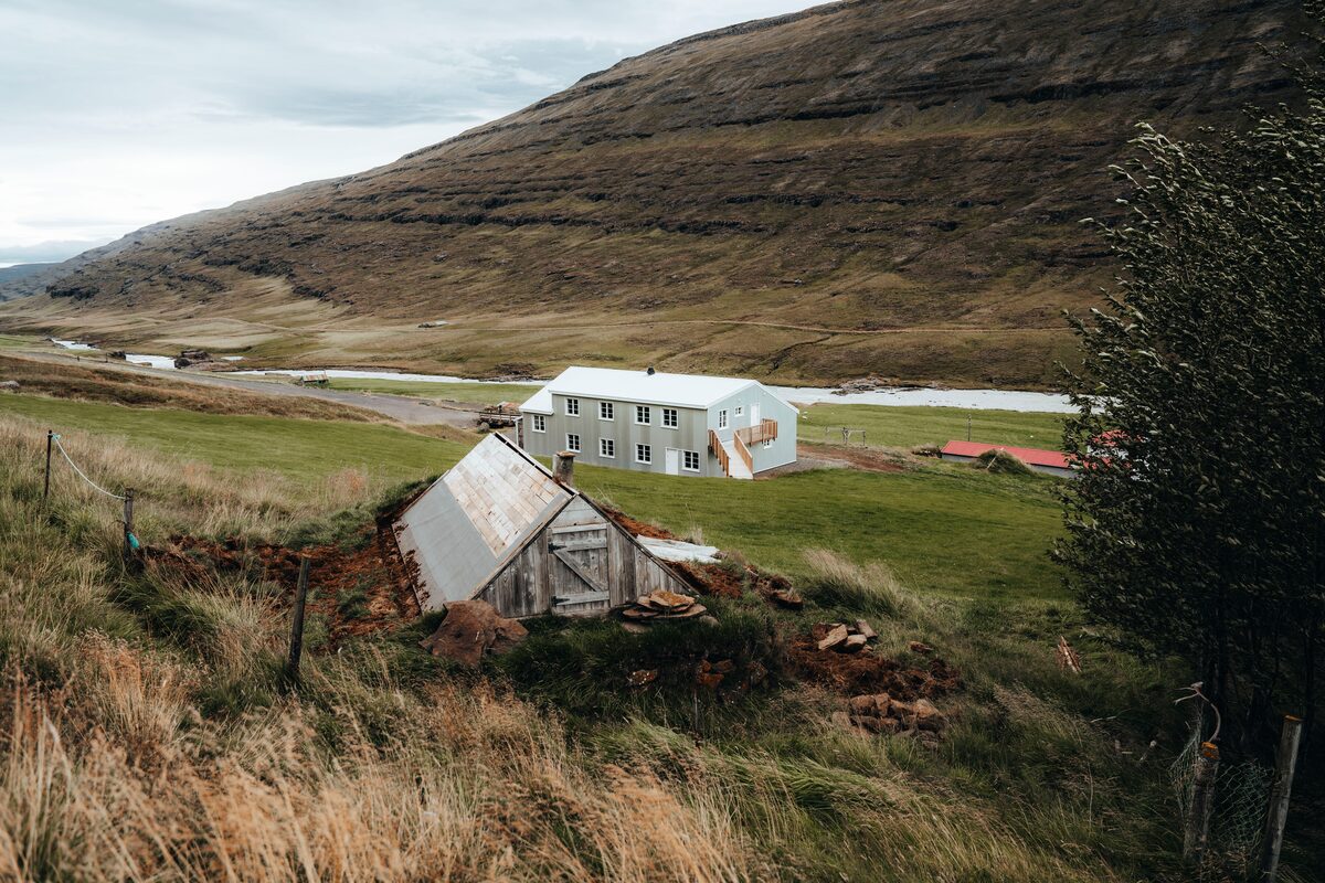 Wilderness center guesthouse surrounded by green grass hills
