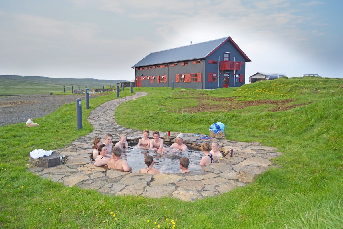 Laugarfell accomodation with tourists using natural hot springs 