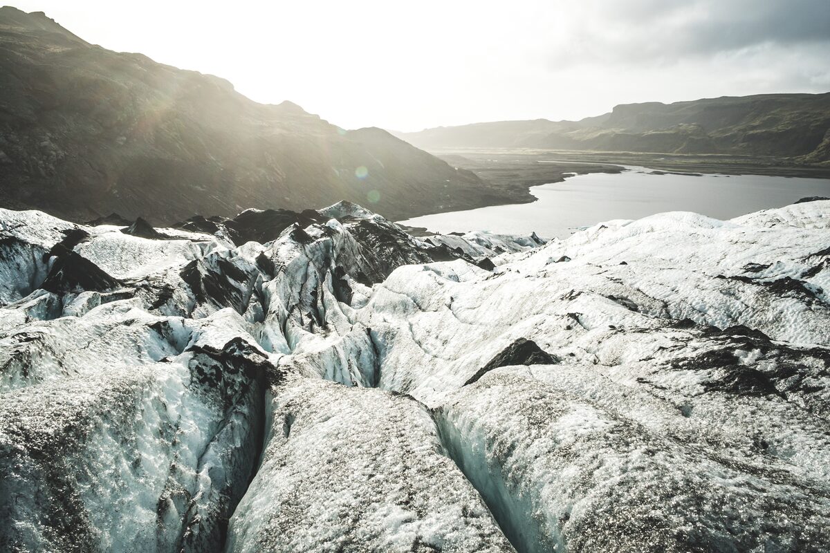 Sun shining over Solheimajokull and reflecting off glacier 