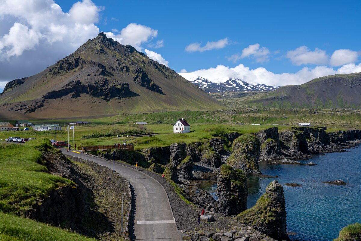 Arnastapi house in front of large mountain in Snaefellsnes Peninsula 