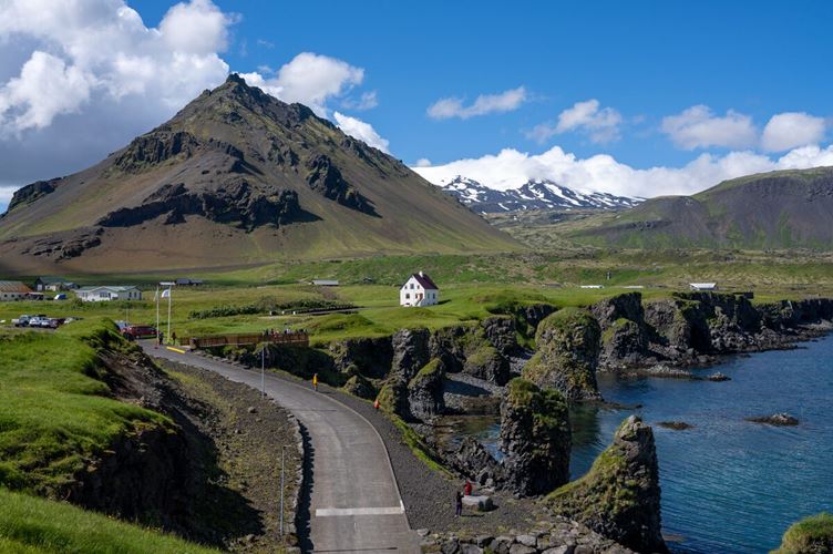 Arnastapi house in front of large mountain in Snaefellsnes Peninsula