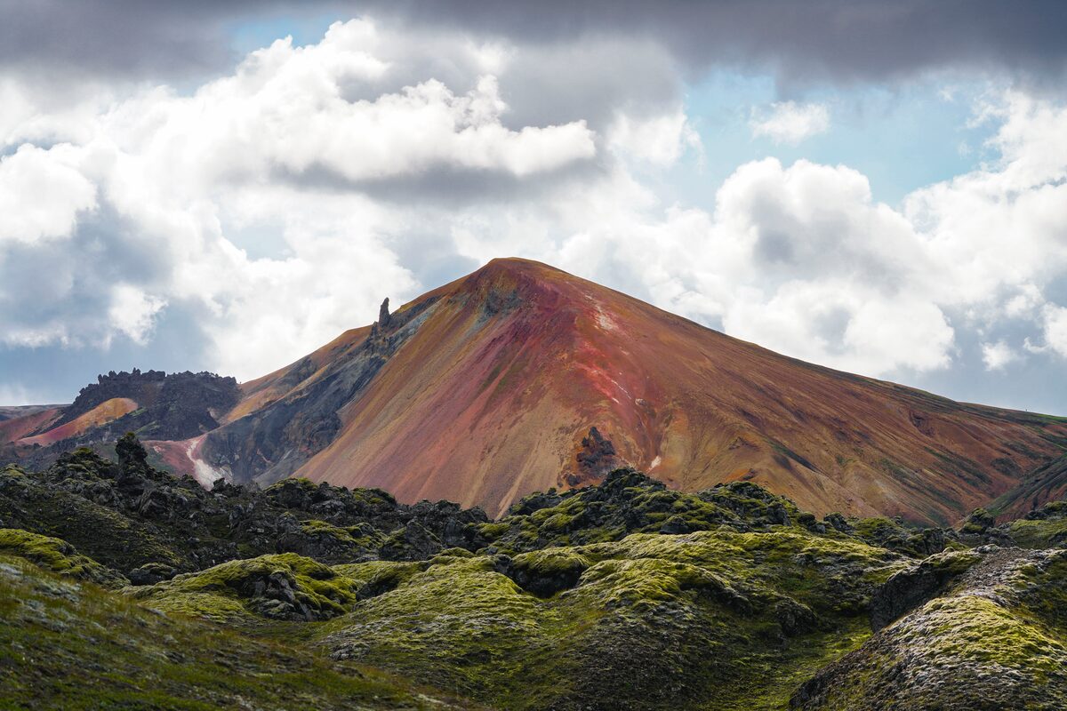 Beautiful red and multi colored mount Brennisteinisalda with moss covered surroundings