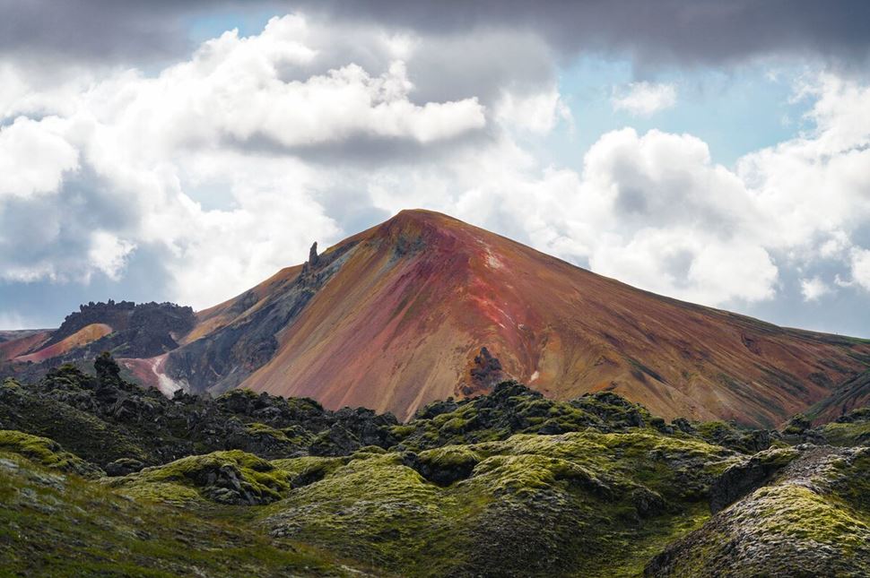 Beautiful red and multi colored mount Brennisteinisalda with moss covered surroundings