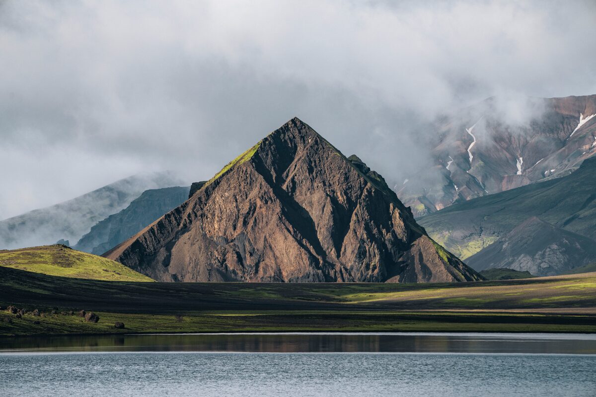 Triangle shaped mountain across lake in Alftavatn, Iceland 