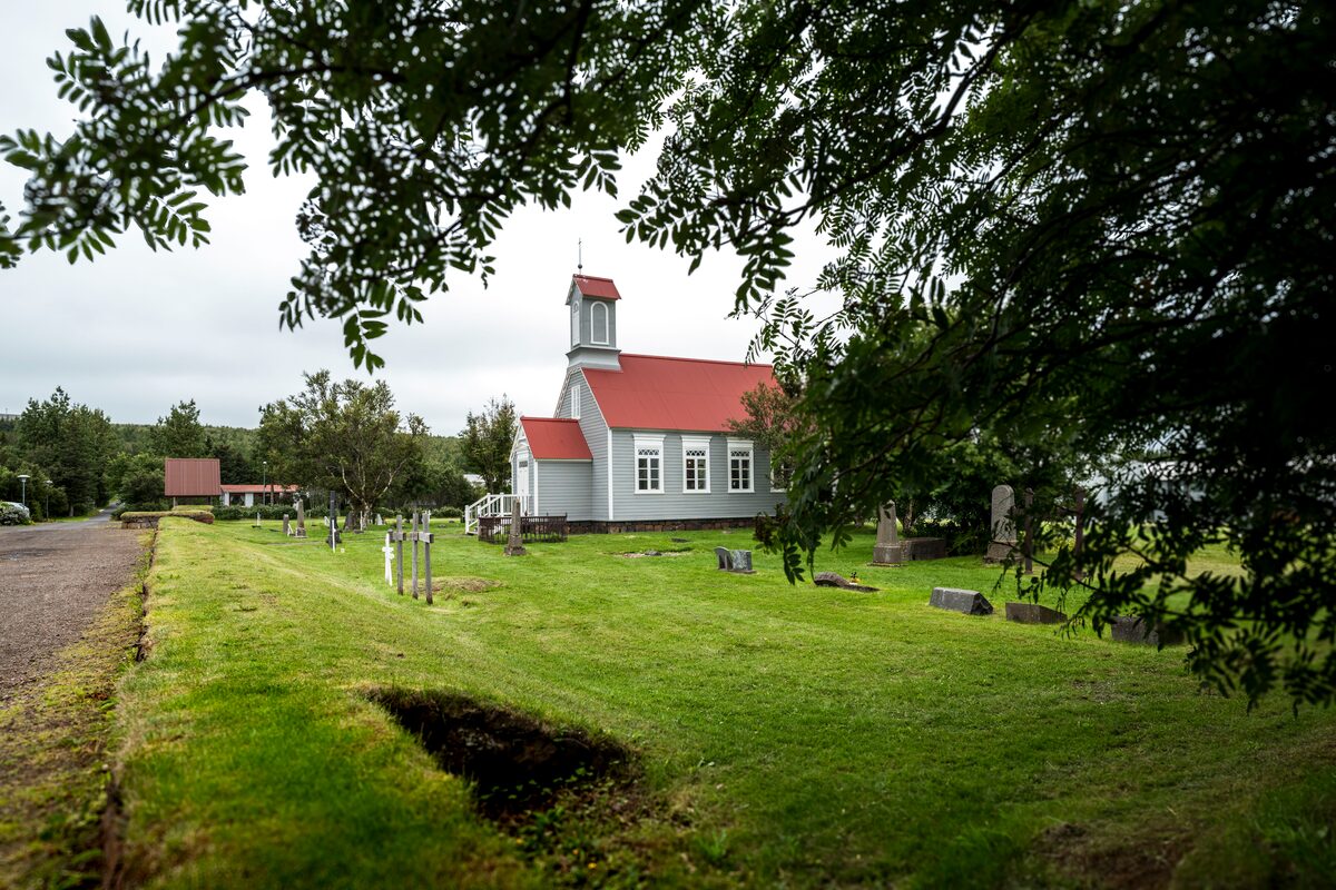 Church in Borgarfjordur Reykholt through trees view