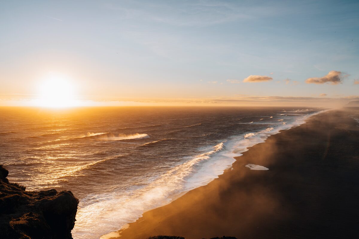 View of the sunset in the Dyrhólaey beach in spring in Iceland.