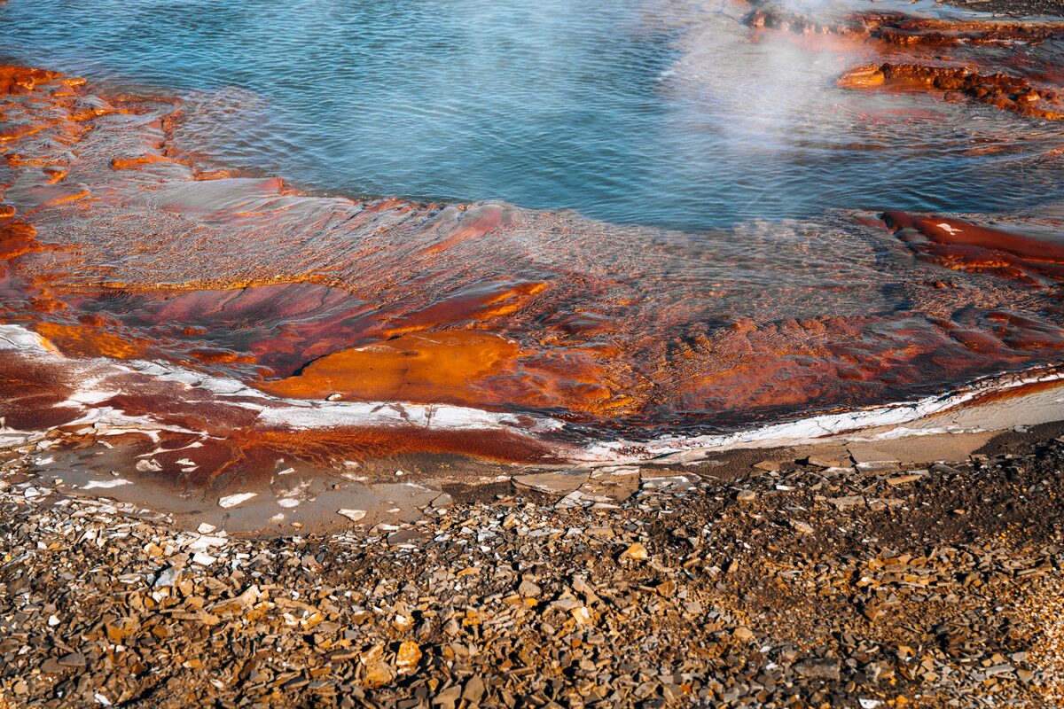 Geothermal pool with interesting earth color beneath at Hveravellir Iceland 