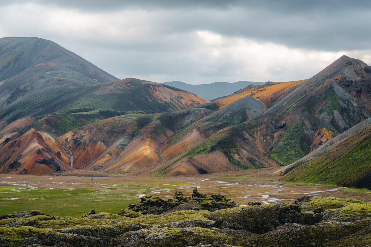 Landmannalaugar hiking open field in front of colorful Rhyolite mountains in summer time
