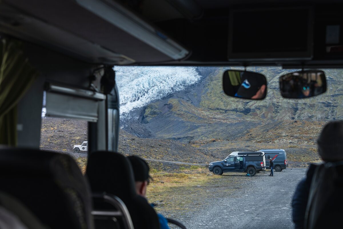 View of Falljokull glacier from inside tour bus window.