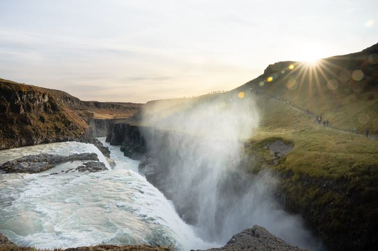 Scenic view of Gullfoss waterfalls close up at sunset during spring.