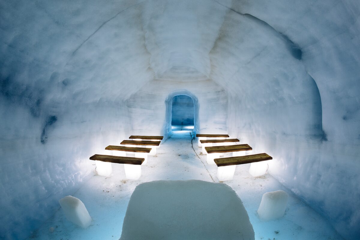 Langjokull into the glacier tunnel chapel room for marriages lit up inside.