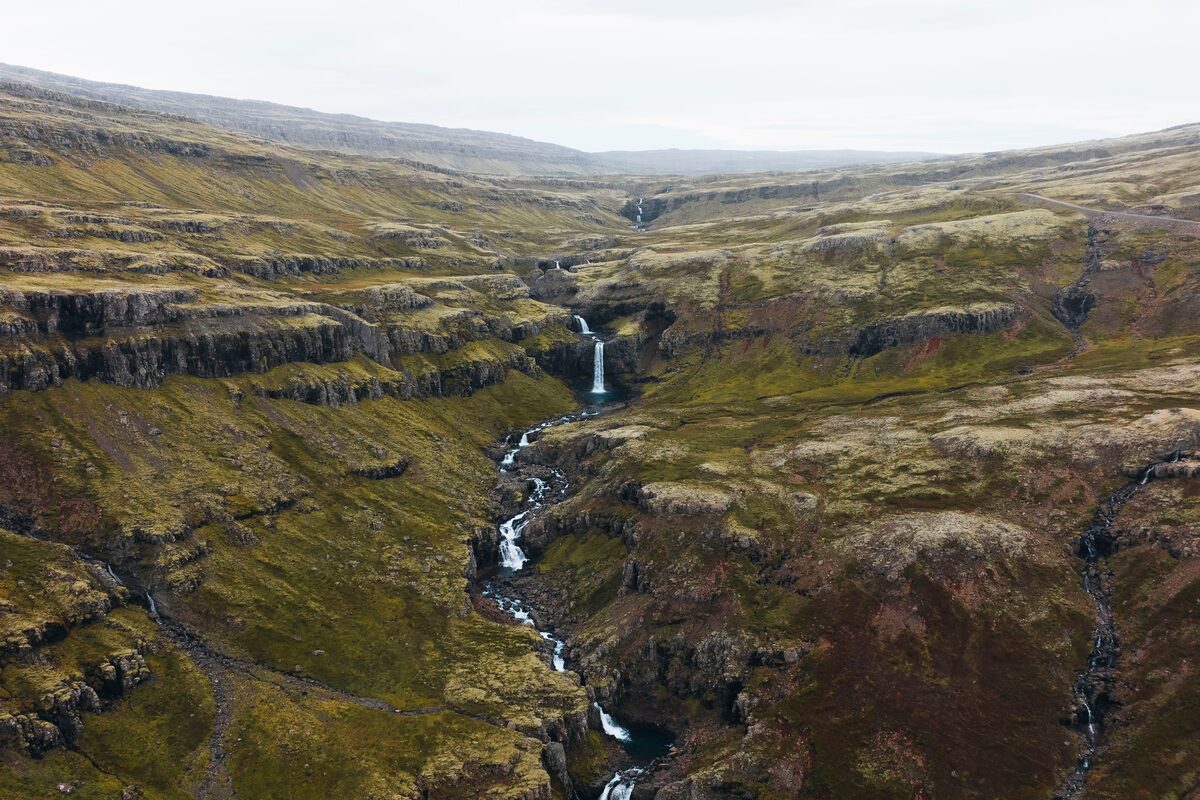 Cascading waterfall stream at Klifbrekkufossar in Eastfjords.