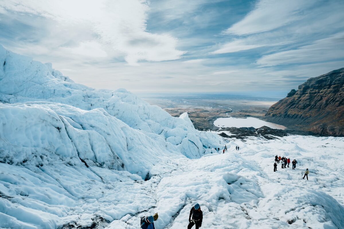View from high on glacier of seperate groups hiking at Vatnajokull.