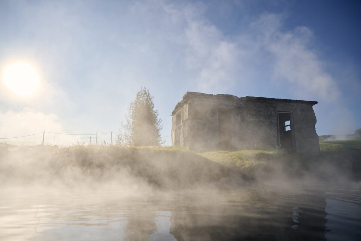 Misty view of Secret Lagoon pool in iceland during spring.