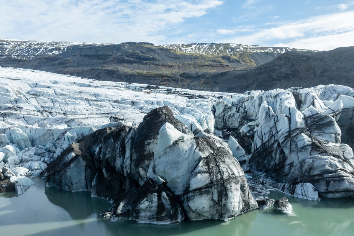 Solheimajokull patterned glacier covered in ash, creating patterns on the glaciers.