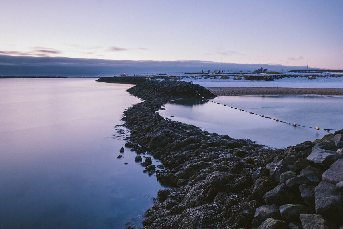 Natuholsvik beach  and coastline with evening skies after sunset.