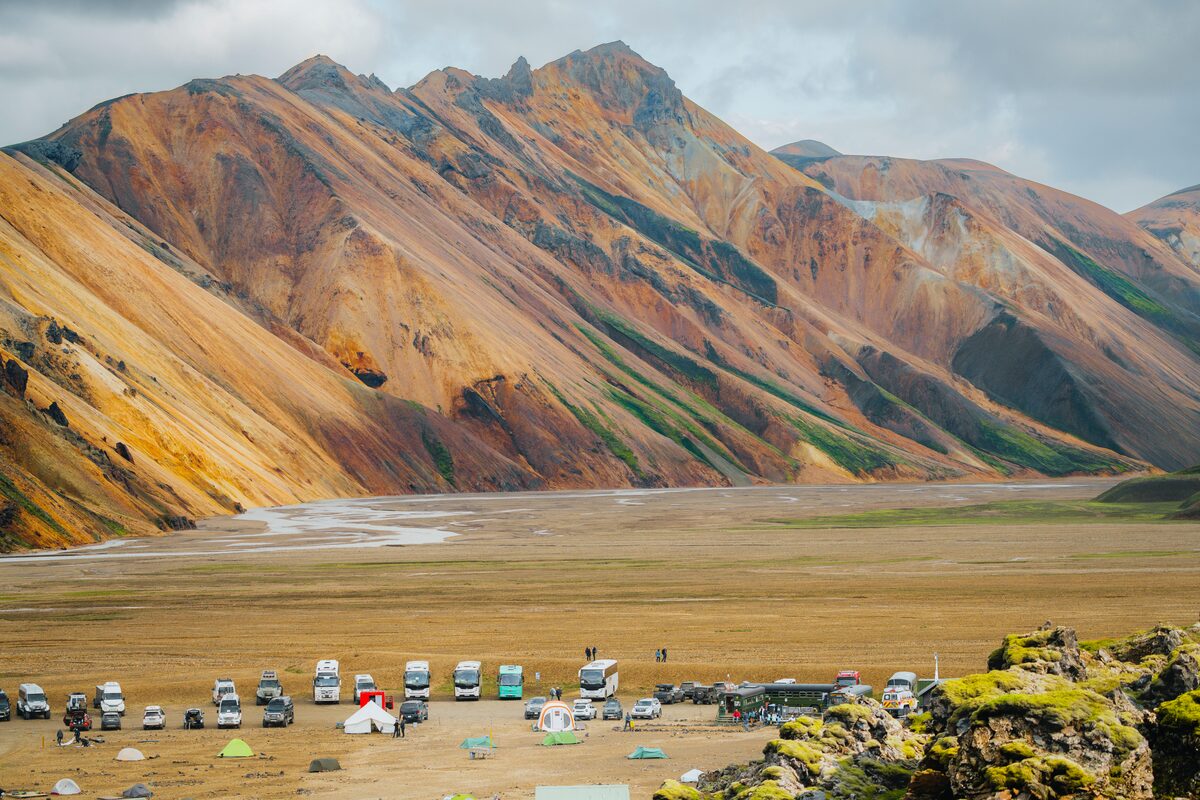 Camping area at Landmannalaugar surrounded by large multi colored  Rhyolite mountains.