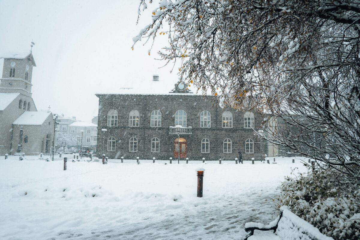 Althing Parliament house in Reykjavik, during heavy snow fall in winter.