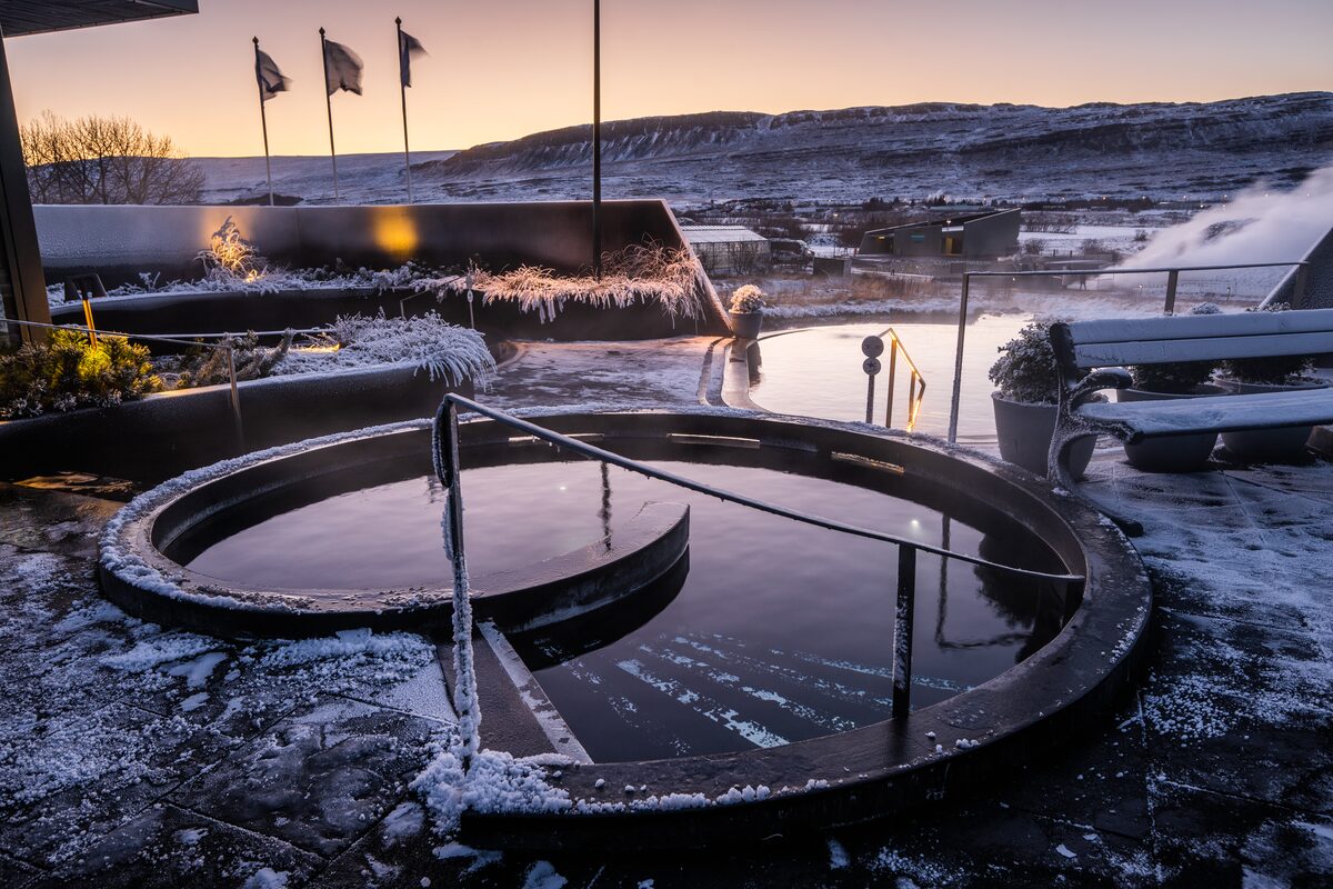 Krauma Geothermal Bath Spa Exterior And Hottub Covered In Snow in iceland
