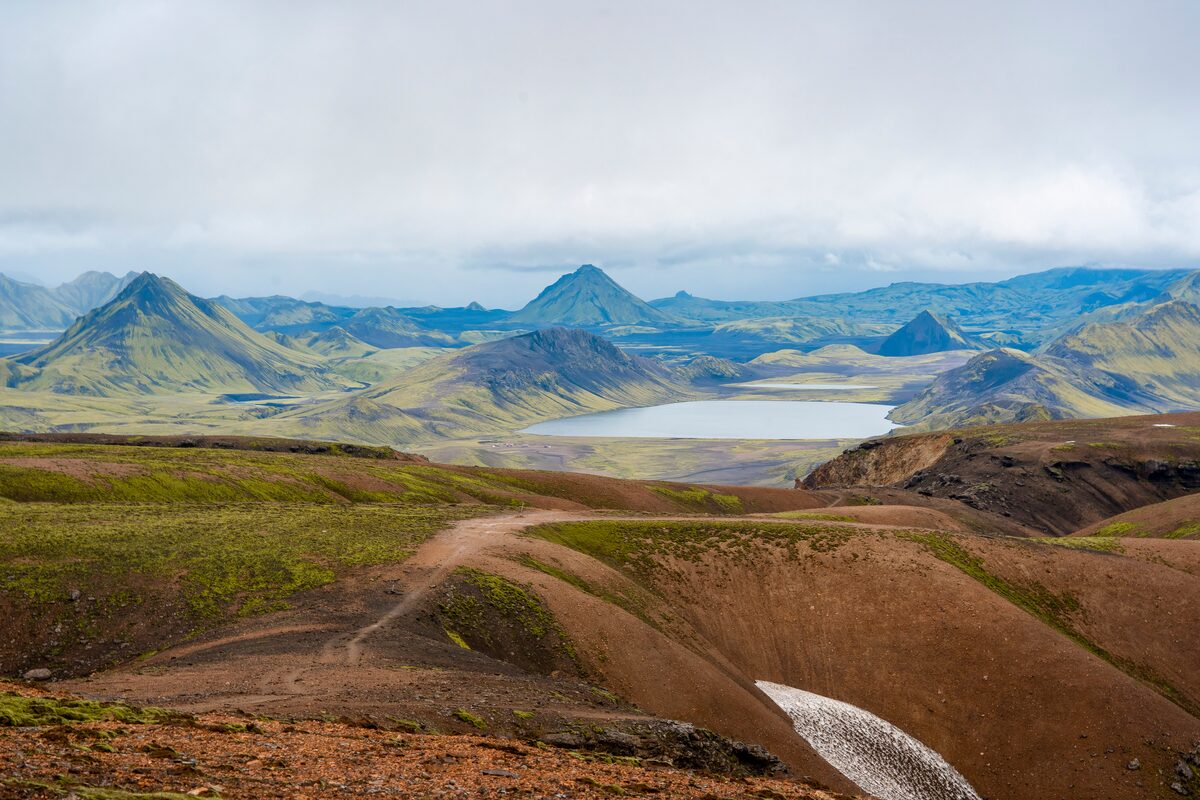 Afltavatn lake in distance, landscape views of mountain terrain on Laugavegur trail, in Iceland.