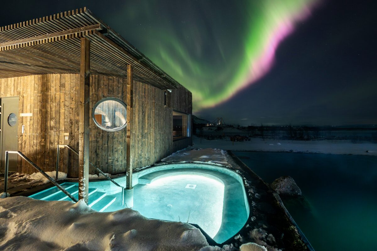 Auroras over Laugaras Lagoon spa outside pool