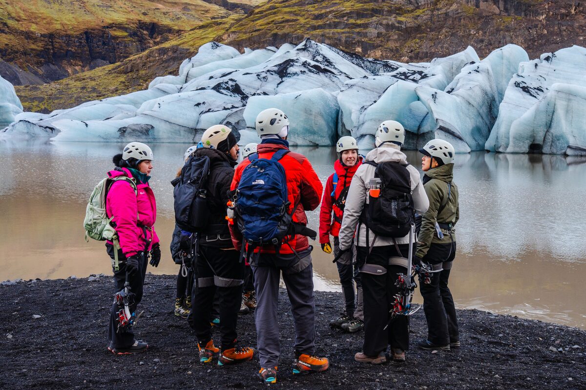 Group Of People In Discussion On A Glacier Hike in iceland