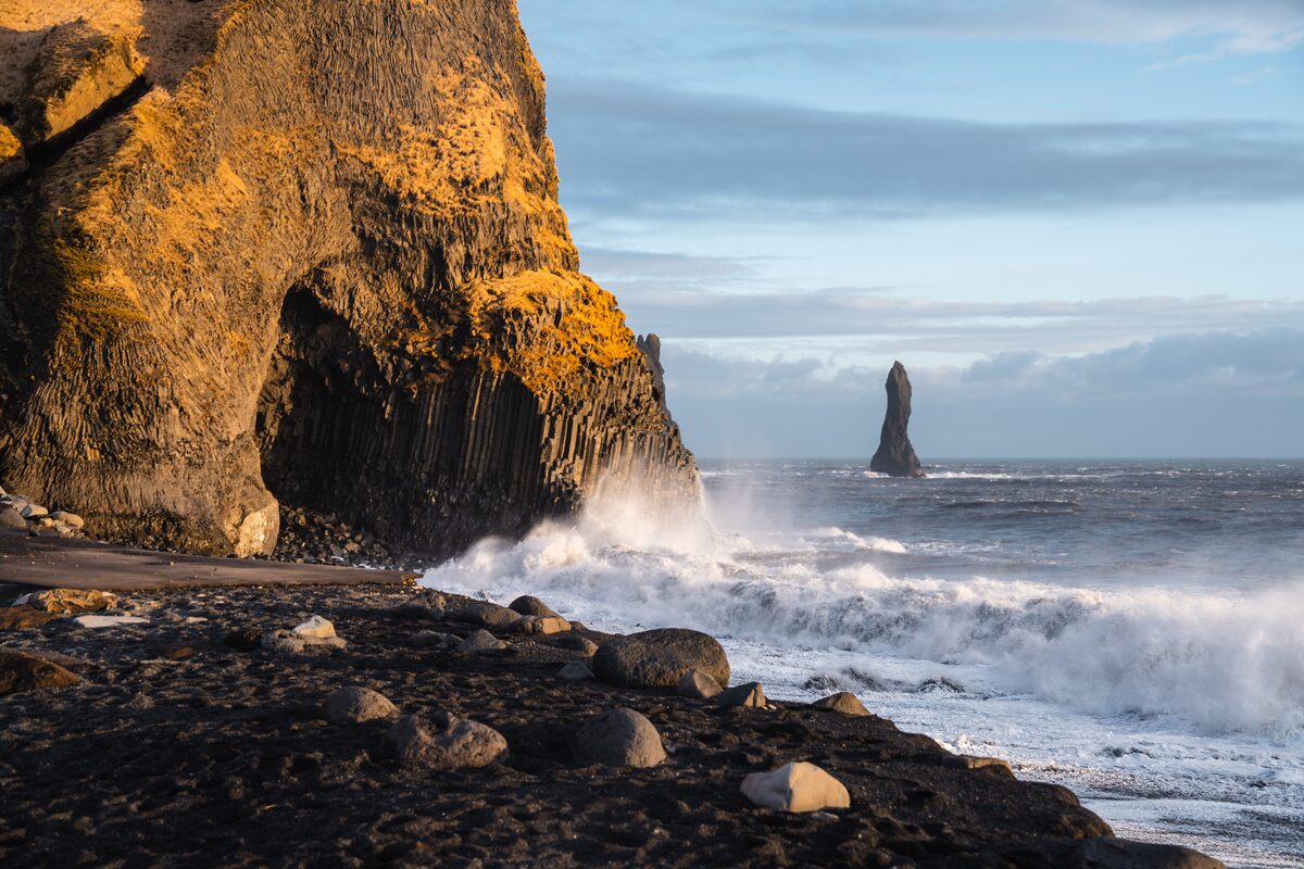 Narrowed shoreline and strong waves at Reynisfjara after coastal erosion in February 2026, South Iceland.