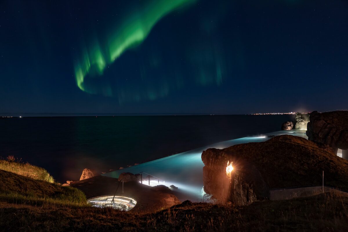 Sky Lagoon infinity pool on the Kársnes Peninsula in Kópavogur near Reykjavík at night.